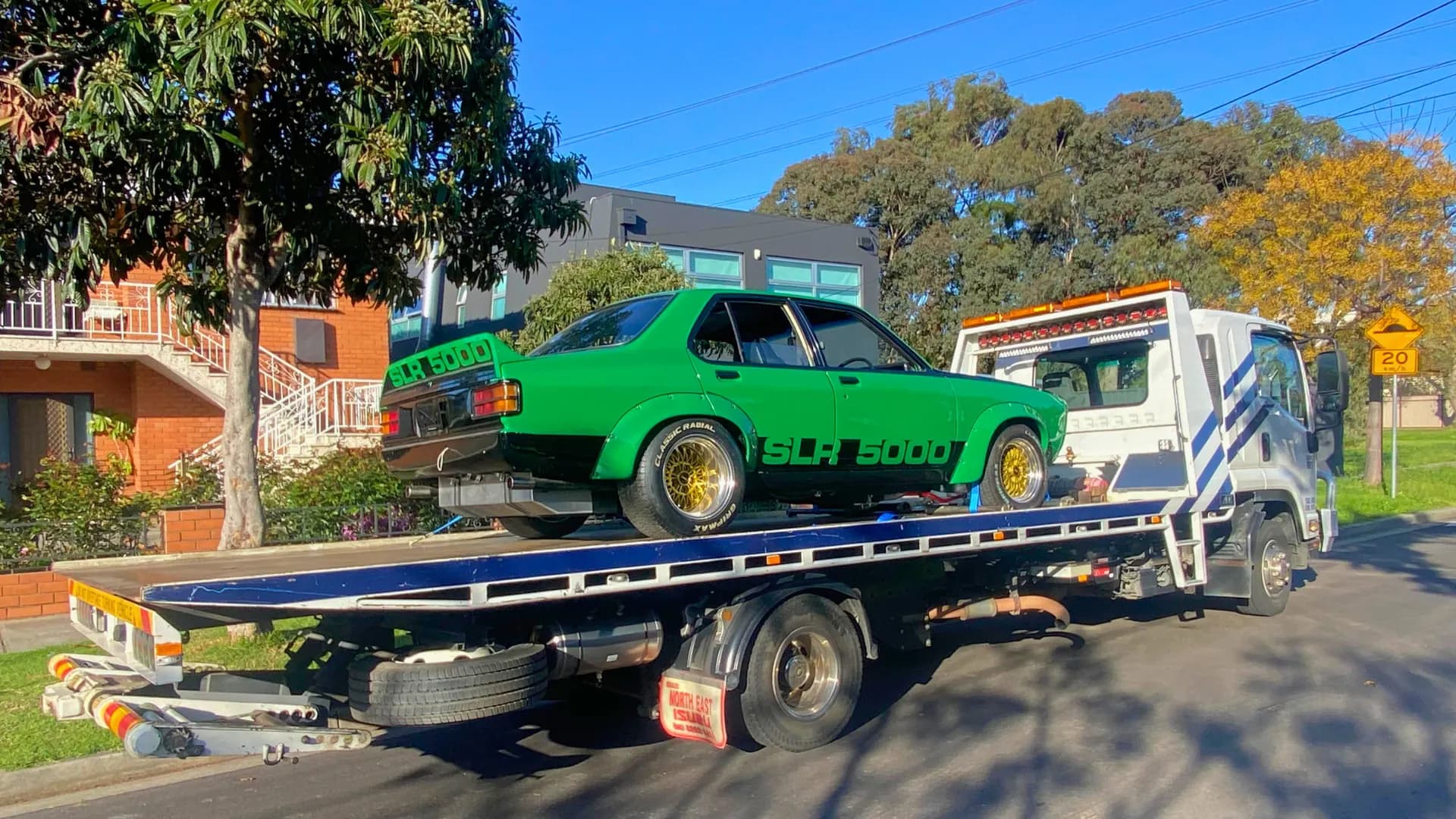 Green Holden Torana SLR 5000 on the All Over Towing tilt tray